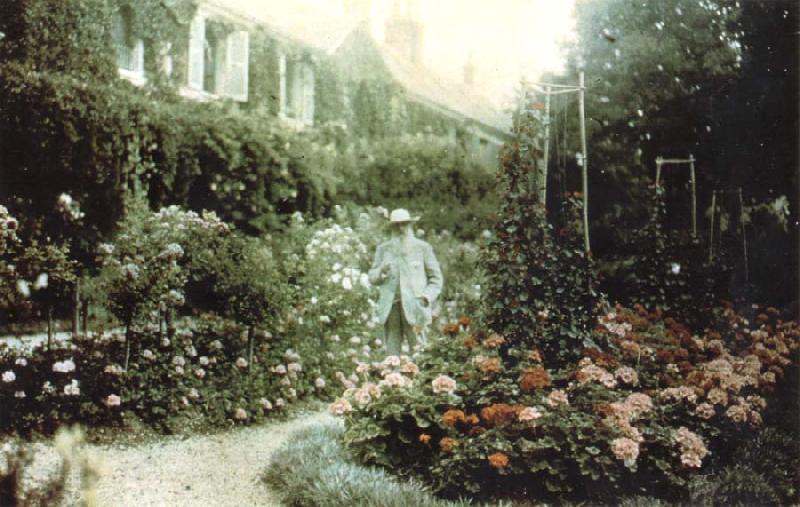 Claude Monet Monet in his garden at Giverny